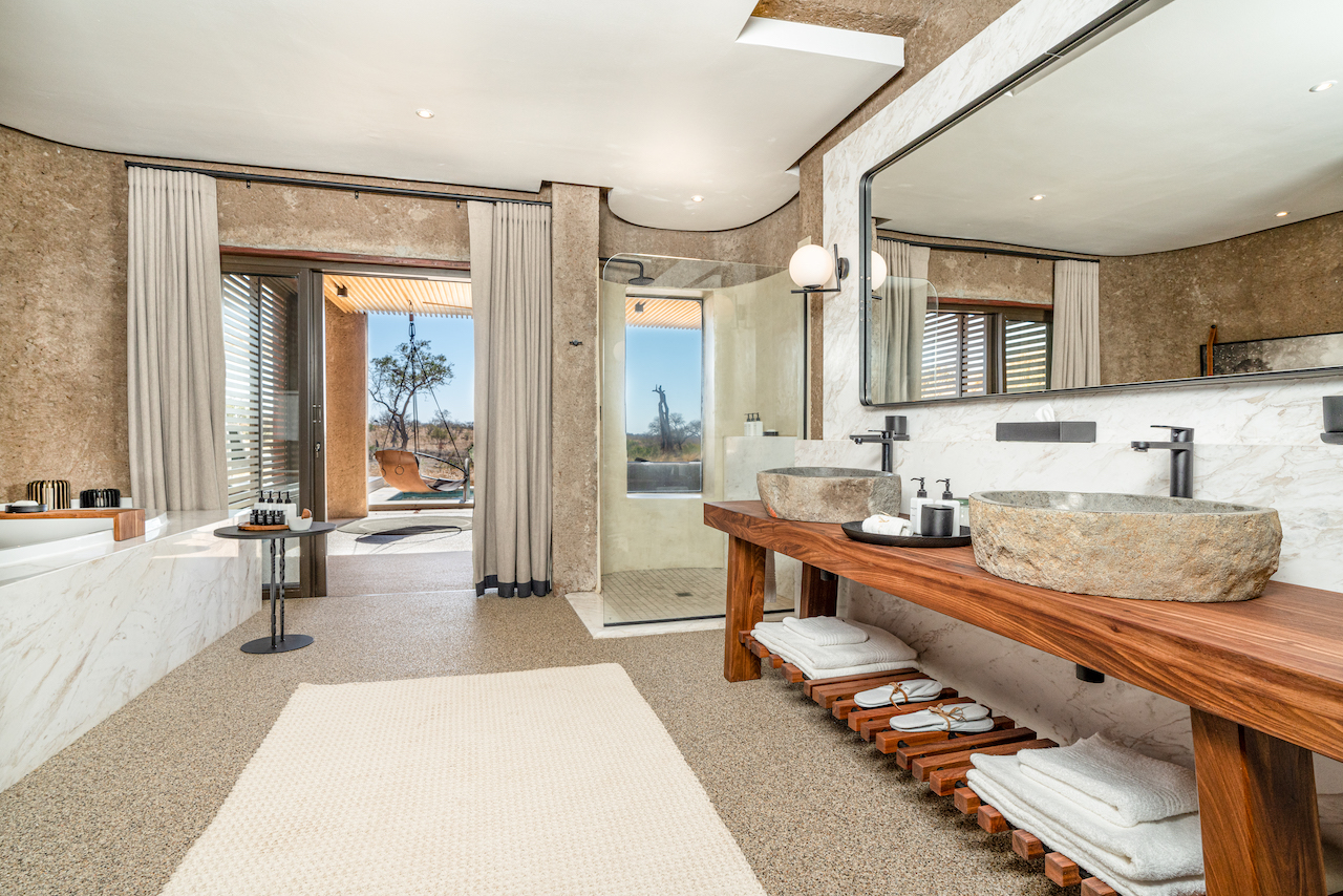 <p>The bathrooms at Sabi Sabi Earth Lodge are designed to provide guests with a luxurious and indulgent experience. Each bathroom is spacious and elegantly decorated, with a large bathtub, a separate shower area, and dual vanities. The bathrooms are also equipped with modern amenities, such as a hairdryer, bathrobes, and high-quality toiletries.</p>
